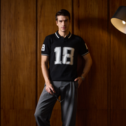 THE VARSITY MESH POLO IN DEEP BLACK