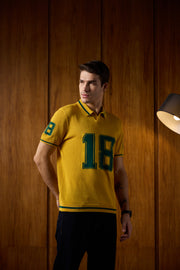 THE VARSITY MESH POLO IN ATHLETIC GOLD