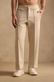 THE PIN TUCK PANTS IN SAND BEIGE